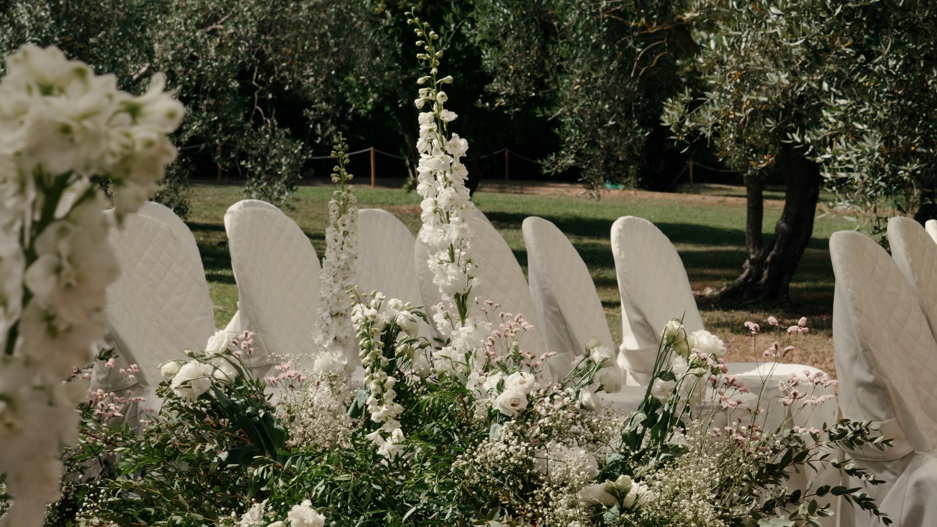 potted flowers with white seats
